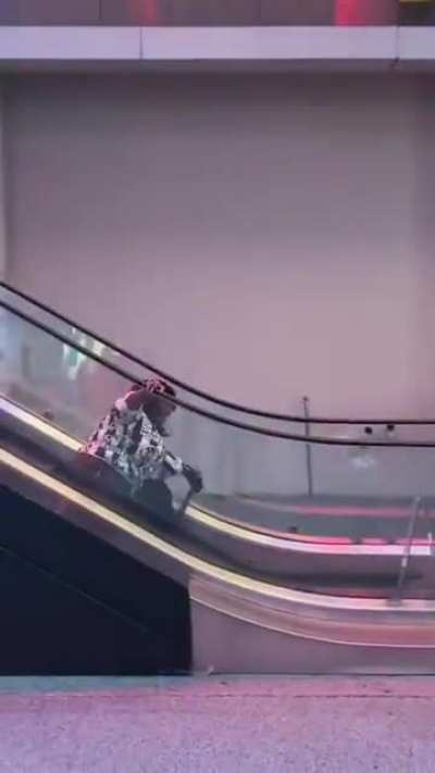 To run down the up escalator