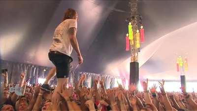 Singer of Dutch band "John Coffey" catches a cup of beer thrown from crowd