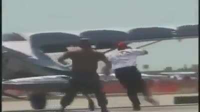 Trained stunt pilot performs "Drunken Plane Thief" act at Airshow