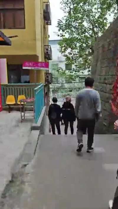 This gentleman in Chongqing, China shows how far down he must go to get to his office
