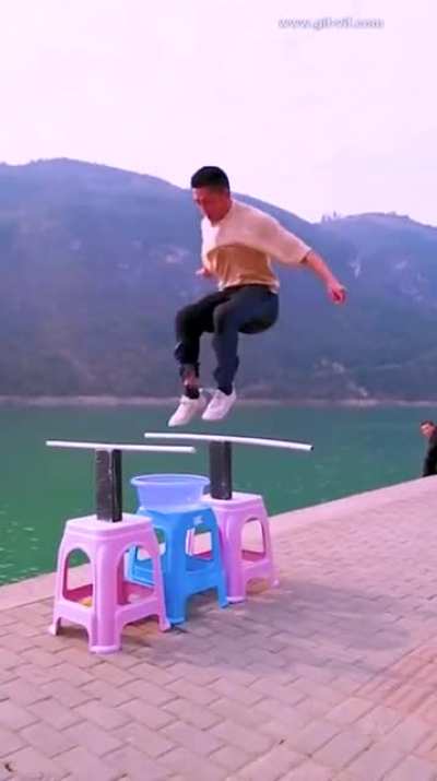 Man Does a Double Jump by "Skipping" His Shoes Over a Bowl of Water