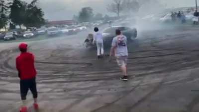 Standing in the path of an idiot doing donuts