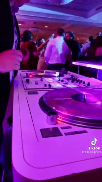 A DJ drops the beat