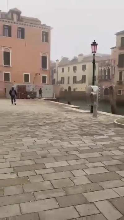 To dive into a "canale" in Venice Italy