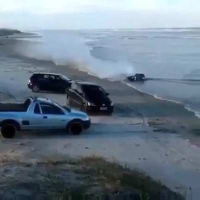 Riding a motorcycle through an approaching tide