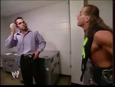 Wrestler talks with intern backstage