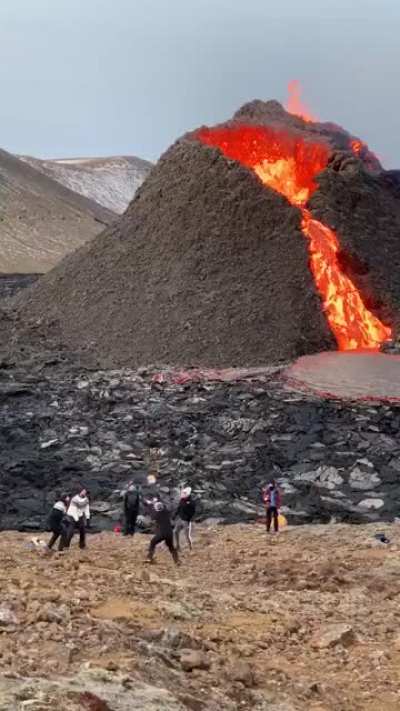? People casually playing volleyball at the volcano in Fagradalsfjall, Iceland