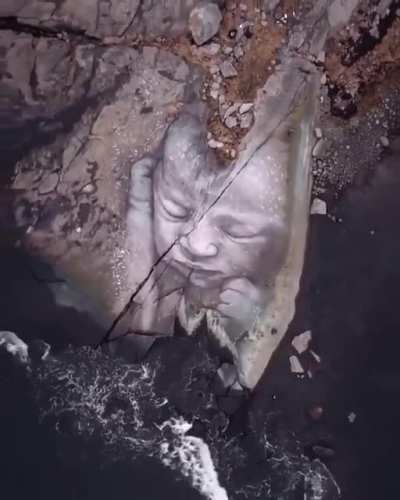 Sculpture of a baby near the ocean