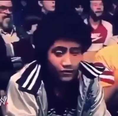 11 year old Dwayne "The Rock" Johnson sitting in the crowd watching his father about to wrestle, 1984.