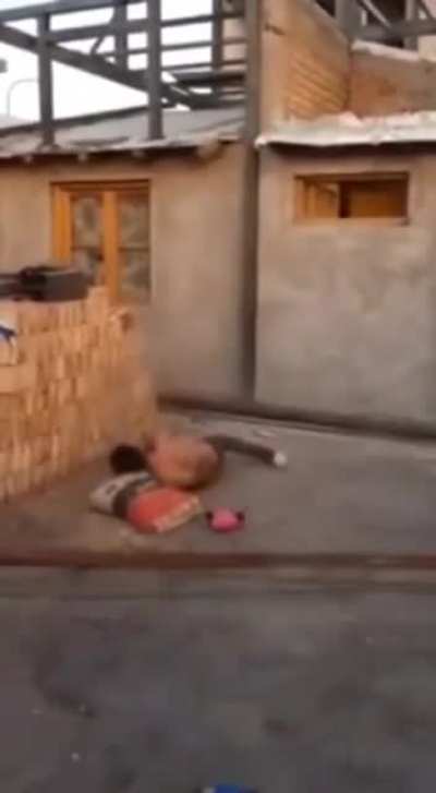Throwing bags of mortar mix at a construction site