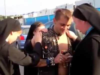 Nuns praying on a punk rock dude