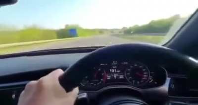 Driving at 200 mph on UK motorway.