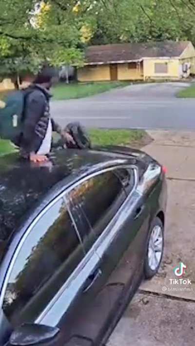 Car owner catches black man on vehicle roof