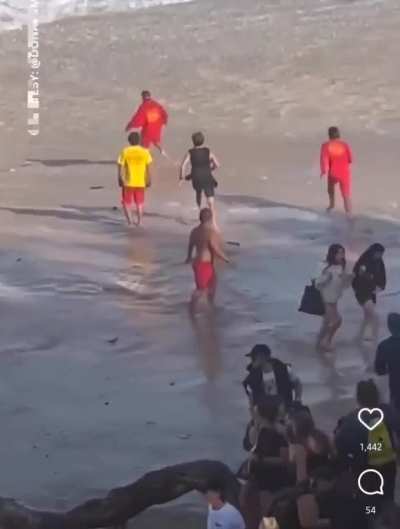 WCGW crossing the tape at a Big Wave competition (peep lifeguard saving the dog)