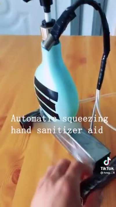 Automatic squeezing hand sanitizer