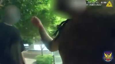 Police officer confronts man yelling in the street