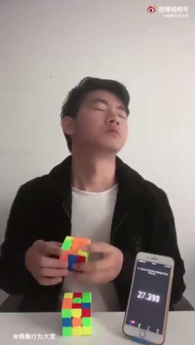 Man trying to solve a Rubik's Cube blindly, but in a different way