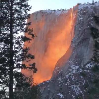 A beautiful "firefall" created by the setting sun illuminating Horsetail Fall in Yosemite National Park.