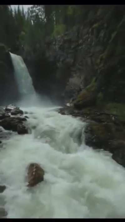 Kayaking over a waterfall.