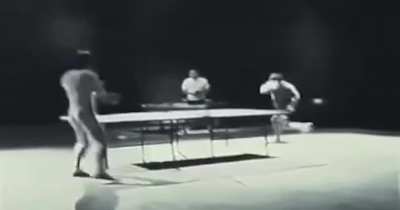 bruce lee playing table tennis with nunchucks as part of a nokia advert