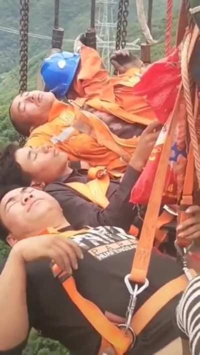 Power line workers in China taking a break in between busy operation shifts.