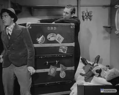 Groucho orders food for his stowaway guests (Chico, Harpo, Not-Gummo), then sees how many people they can squeeze into the smallest cabin aboard the ship. From the 1935 Marx Brothers film "A Night at the Opera".