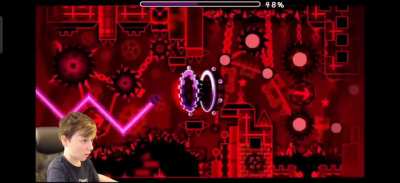 Kid fakes "beating" a very hard level in his first try.