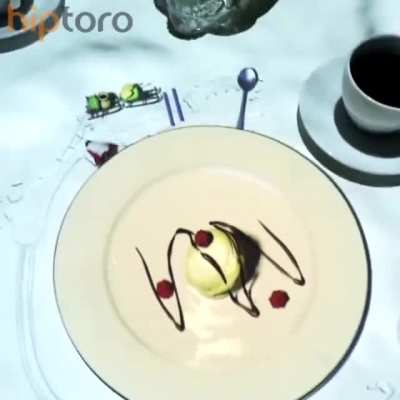 The "Le Petit Chef (Little Chef)" restaurant in France, came up with an original way to entertain guests while waiting for their order by using an overhead 3D projector on the ceiling. The animation is on the table and your plate.