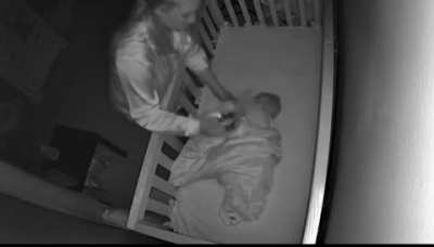 A mother notices an intruder on the baby monitor