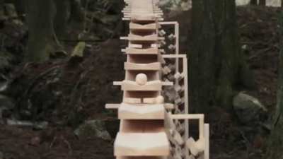 Enormous xylophone in the woods of Kyushu, Japan plays a Bach tune when a wooden ball rolls down each "key."