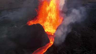 ? Once I stopped filming, little lava pieces started raining down all over us spectators. They looked like shiny brown popcorn, weighed nothing, and had already completely cooled down from the distance they'd been thrown up in the air - Fagradalsfjall vol
