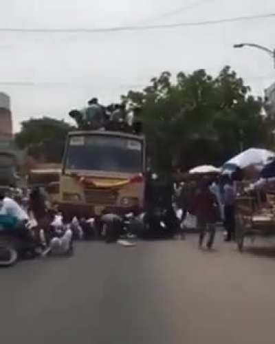 Sitting on top of a running bus