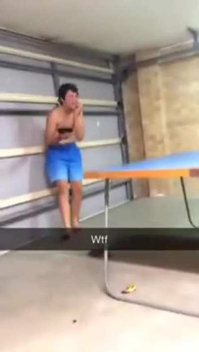 Kid throws ping pong paddle at his brother
