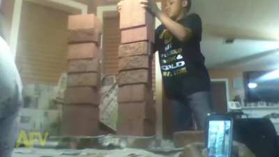 Stacking bricks on a glass table... what could go wrong?