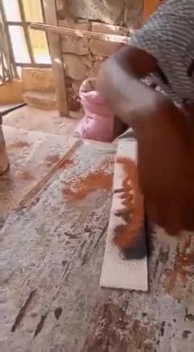 This dude putting sand into a plank