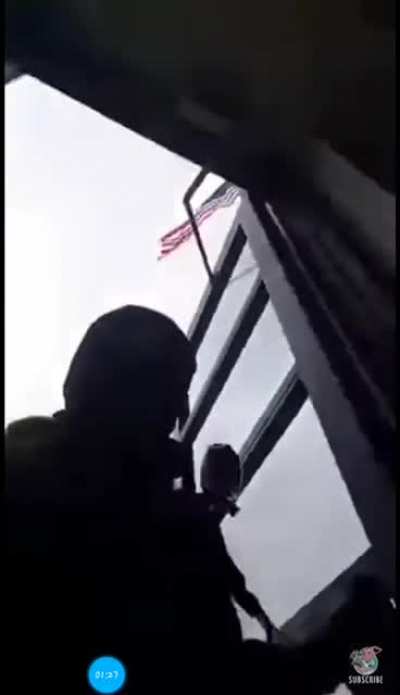 Man goes into a police station with a gun because he got pulled over and got scared.