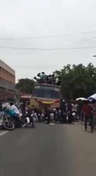 Standing on top of a moving bus