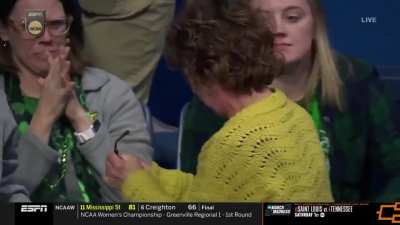 Mom watching her son's wrestling match