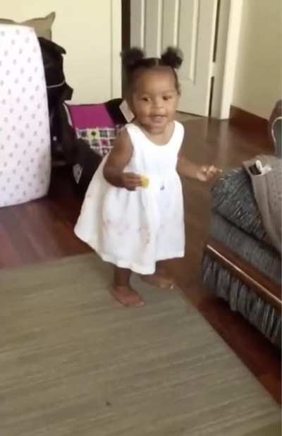 Guy reacts to his daughter taking her first steps