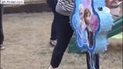 Trying to help your daughter break a pinata
