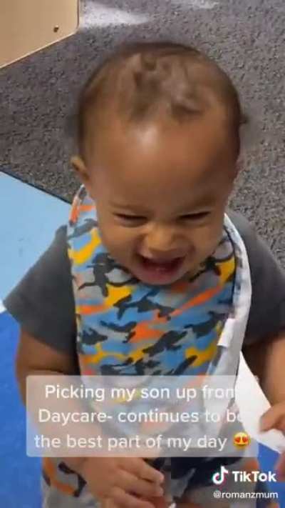 The reaction of her son when she comes to pick him up