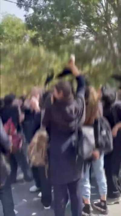 Young Iranian students protest against hijab and dictator ship and chant "death to the dictator".