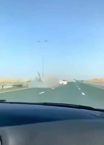 Tesla hitting a camel in the middle of the street, in Dubai.