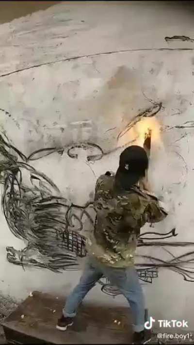 "Painting" with burning wood