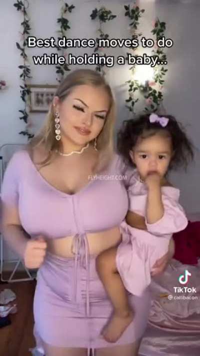 Dancing while holding a baby