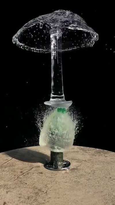 When a water balloon meets two sharp objects