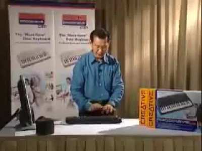 Asian Guy Plays Drums On A Keyboard