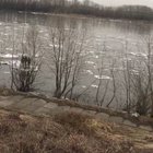 Three kids floating down the river on ice