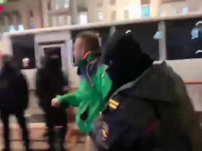 A protester in Russia shouting "Arrest Putin, Not Me" during arrest.