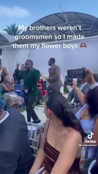 Brothers weren't groomsmen so she made them Flower Boys ?